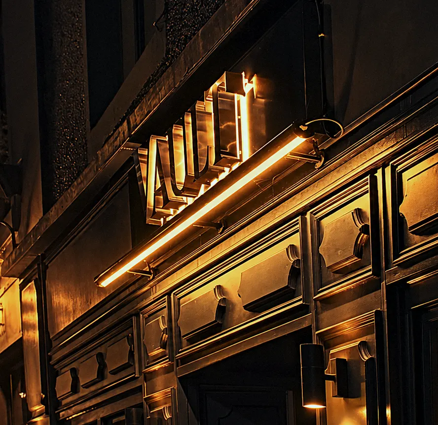 The lit frontage of Vault Bar + Kitchen on King Street, Whalley, at night